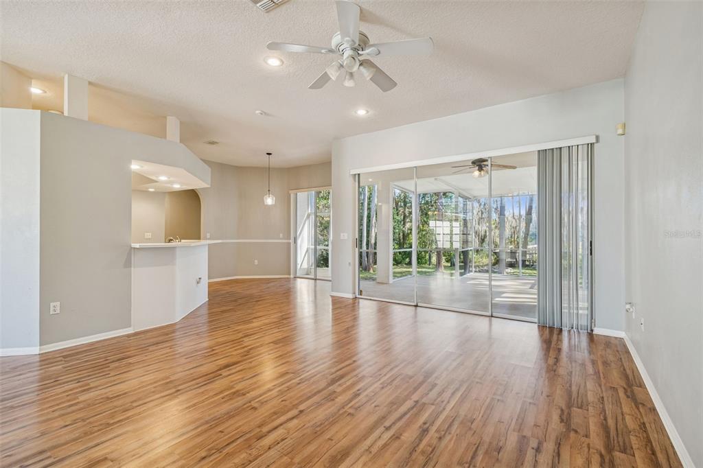6070 Drexel Road Land O' Lakes, FL 34638 - Photo 5 of 23 a view of empty room with wooden floor and fan