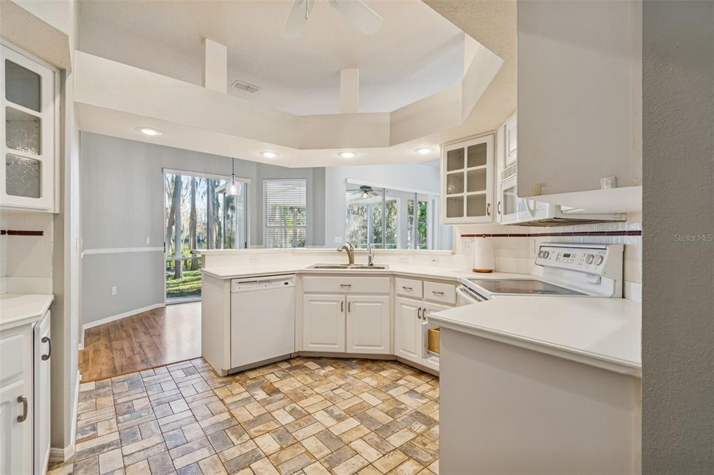 6070 Drexel Road Land O' Lakes, FL 34638 - Photo 6 of 23 a kitchen with a sink stove and cabinets