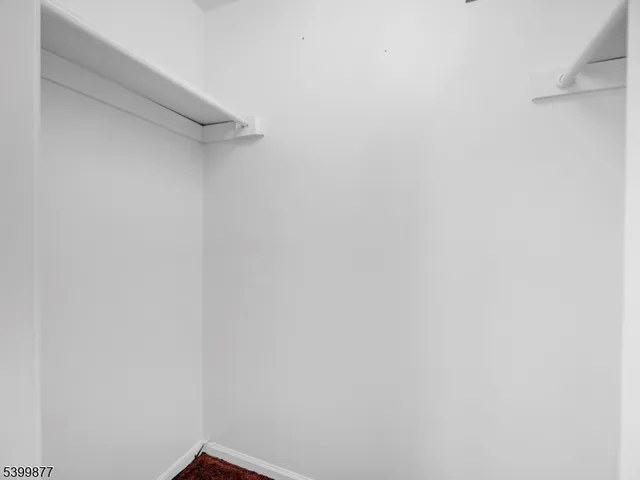 a front view of a residential apartment building with a yard