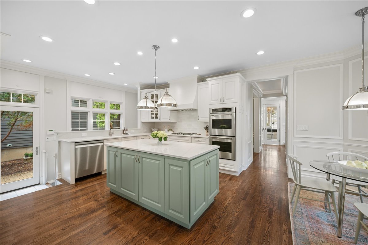556 Willow Road Winnetka, IL 60093 - Photo 13 of 43 a kitchen with stove and wooden floor