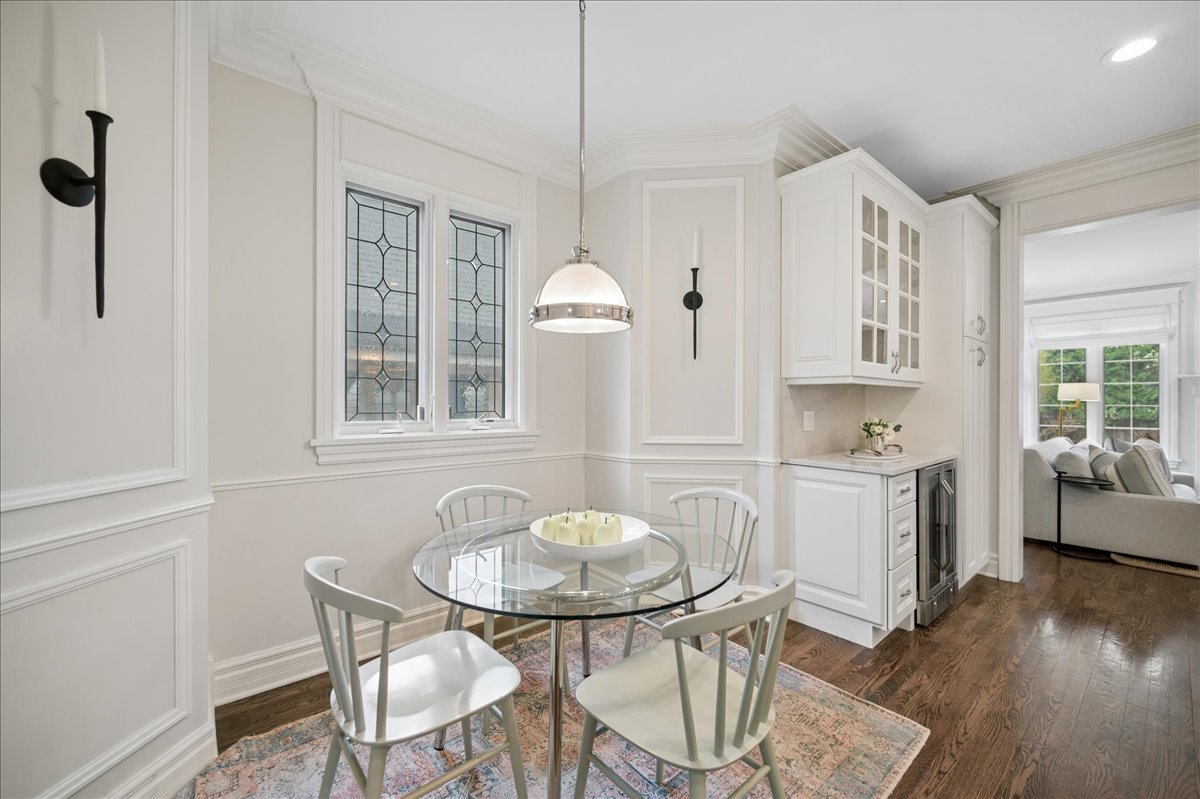 556 Willow Road Winnetka, IL 60093 - Photo 17 of 43 a view of a dining room with furniture window and wooden floor