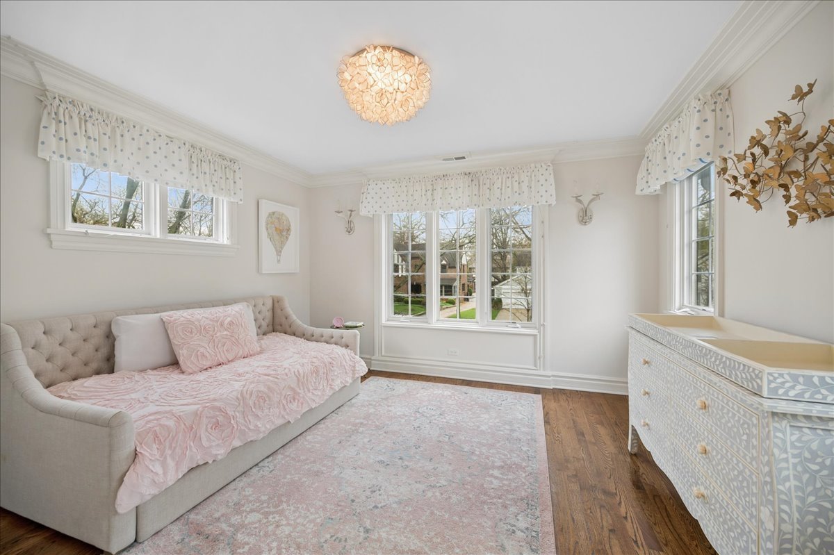 556 Willow Road Winnetka, IL 60093 - Photo 25 of 43 a bedroom with a bed and a window