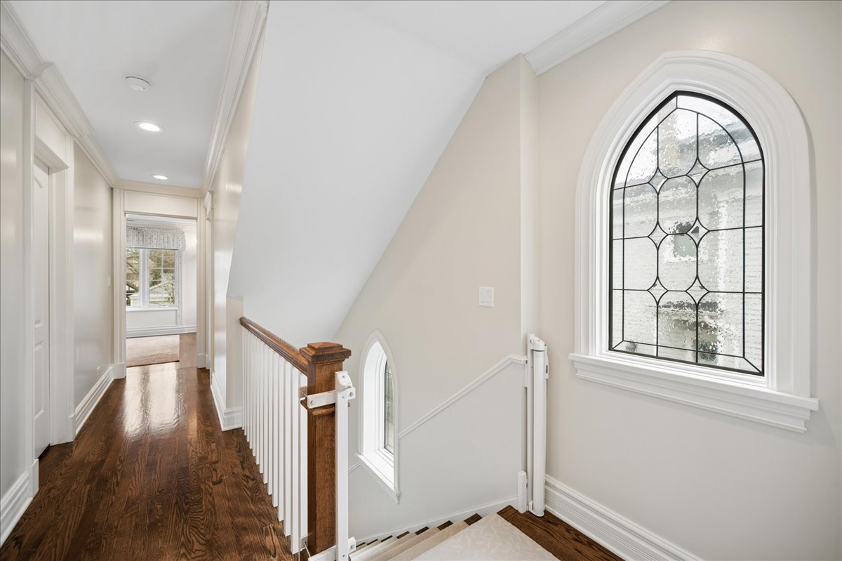 556 Willow Road Winnetka, IL 60093 - Photo 29 of 43 wooden floor in an empty room with a window