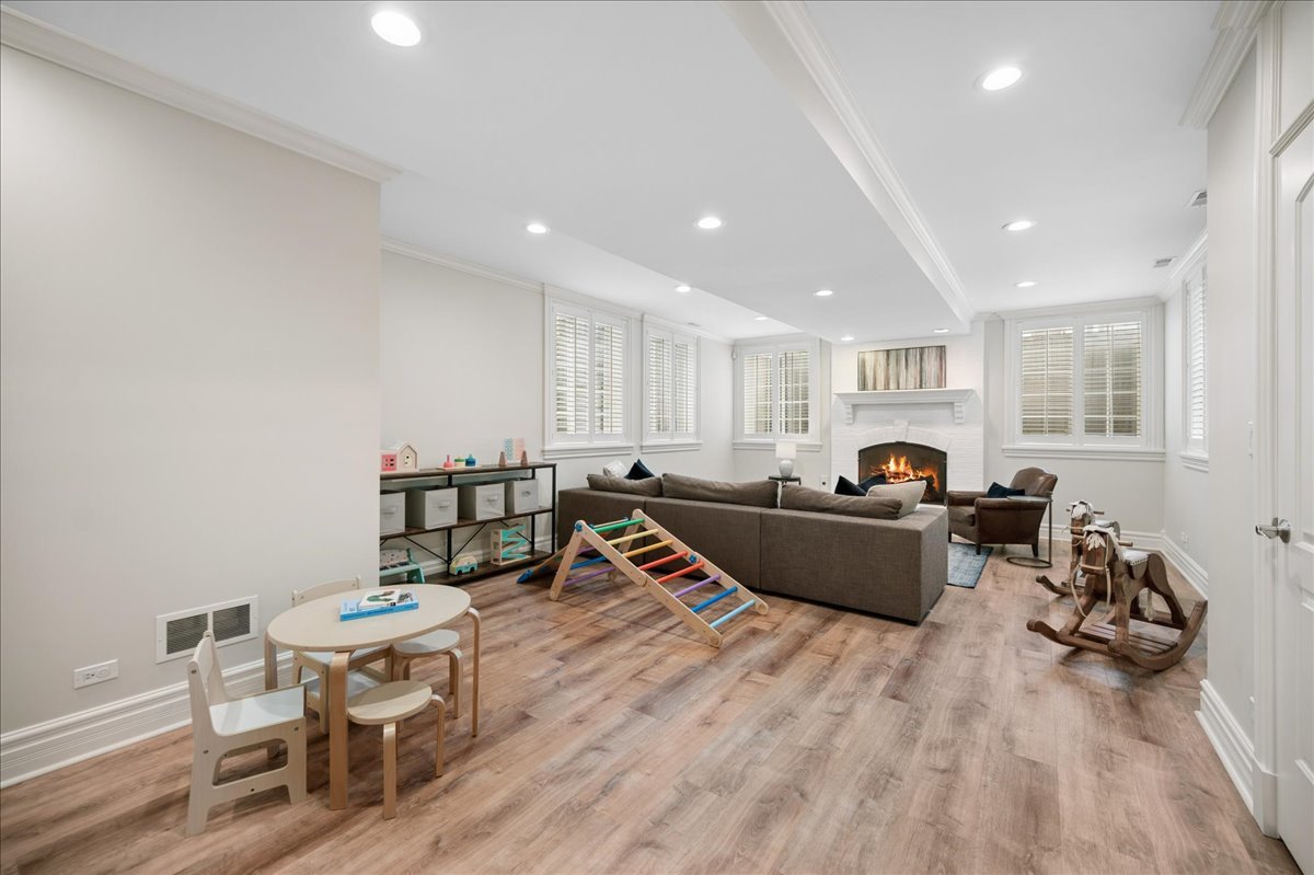 556 Willow Road Winnetka, IL 60093 - Photo 32 of 43 a living room with furniture a window and a table