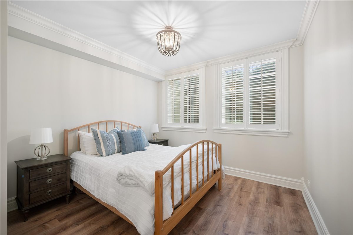 556 Willow Road Winnetka, IL 60093 - Photo 36 of 43 a bed room with a bed and a window