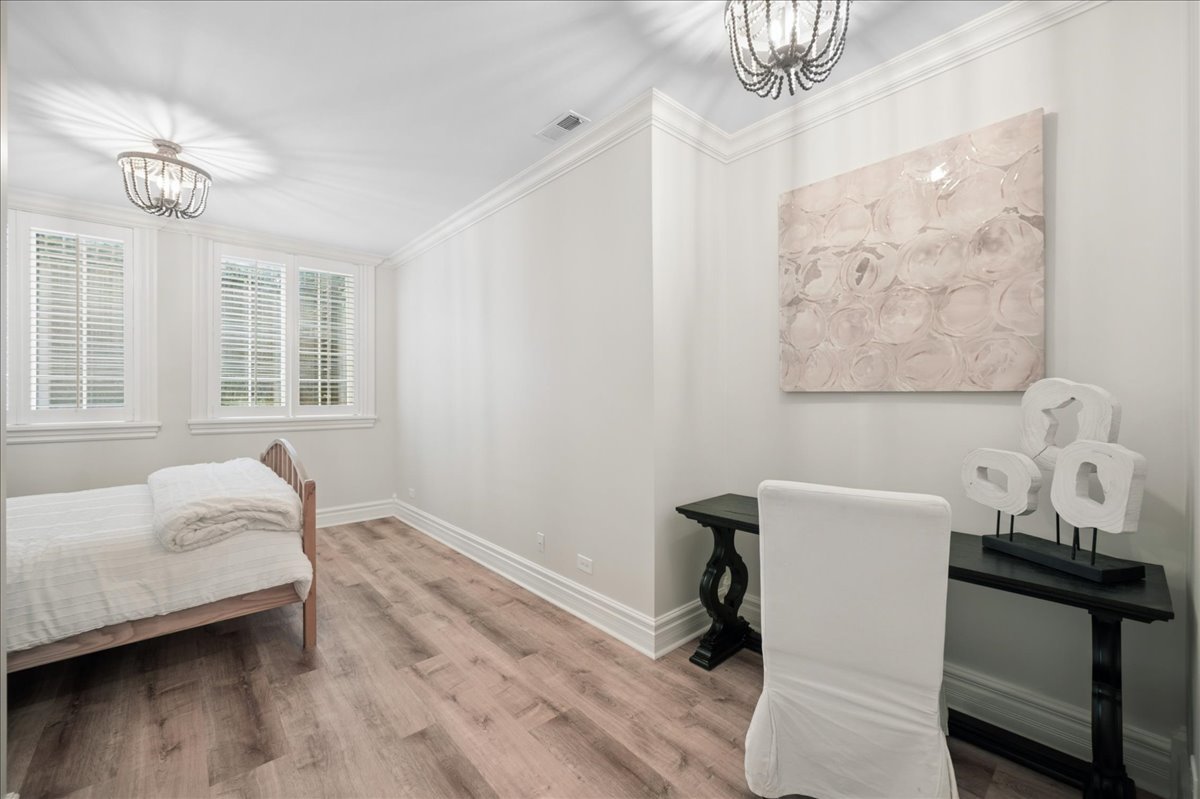 556 Willow Road Winnetka, IL 60093 - Photo 37 of 43 a bedroom with a bed and a window