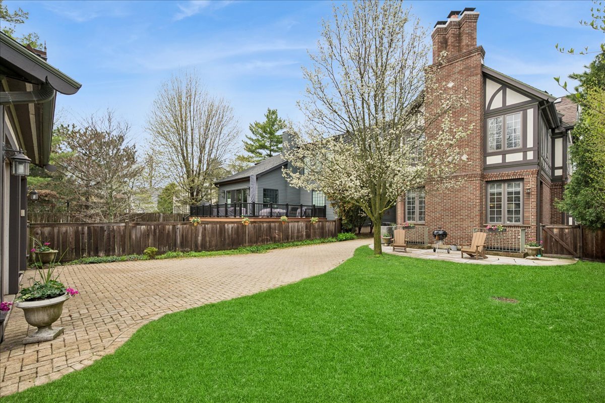 556 Willow Road Winnetka, IL 60093 - Photo 40 of 43 a swimming pool with barbeque oven and outdoor seating