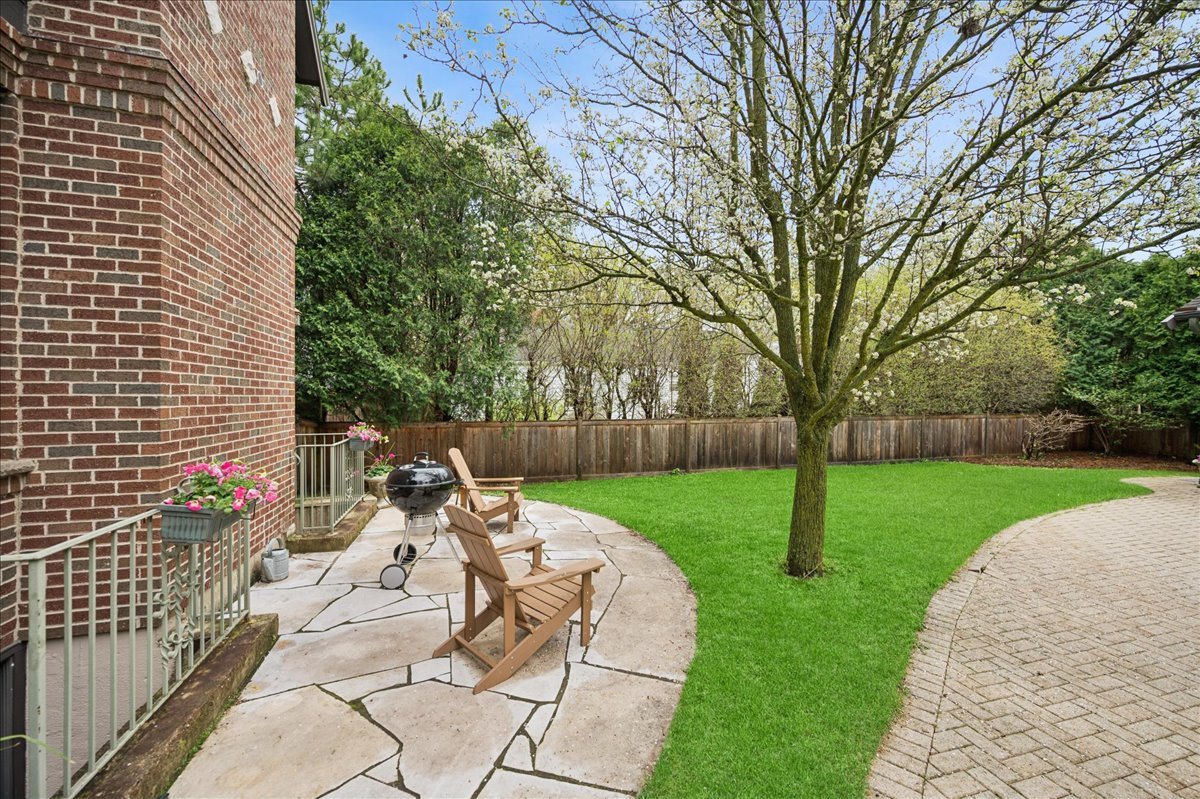 556 Willow Road Winnetka, IL 60093 - Photo 41 of 43 a view of a patio with chairs and a yard