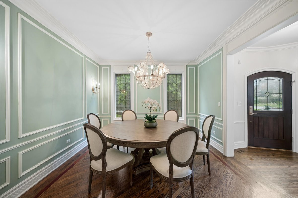 556 Willow Road Winnetka, IL 60093 - Photo 5 of 43 a view of a dining room with furniture window and wooden floor