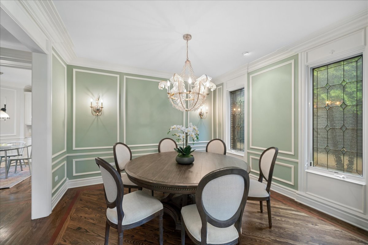 556 Willow Road Winnetka, IL 60093 - Photo 6 of 43 a view of a dining room with furniture window and wooden floor