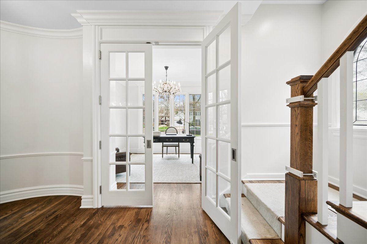 556 Willow Road Winnetka, IL 60093 - Photo 9 of 43 a view of wooden floor and windows in a room