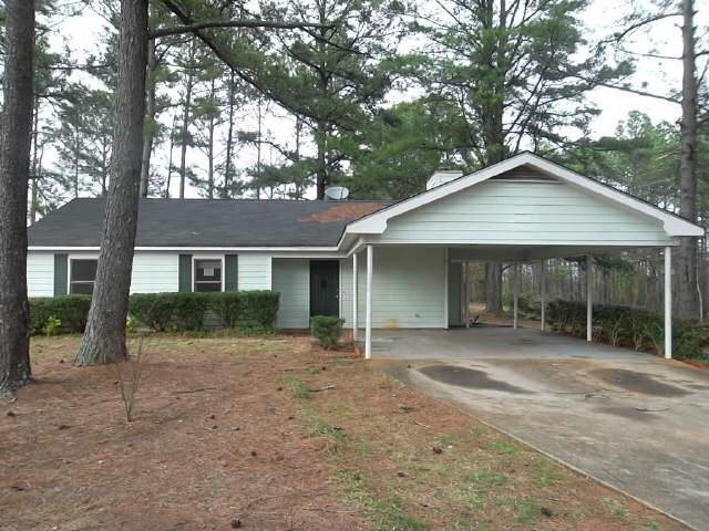 690 Campbell Road Covington, GA 30014 - Photo 1 of 1 a front view of a house with a yard and porch