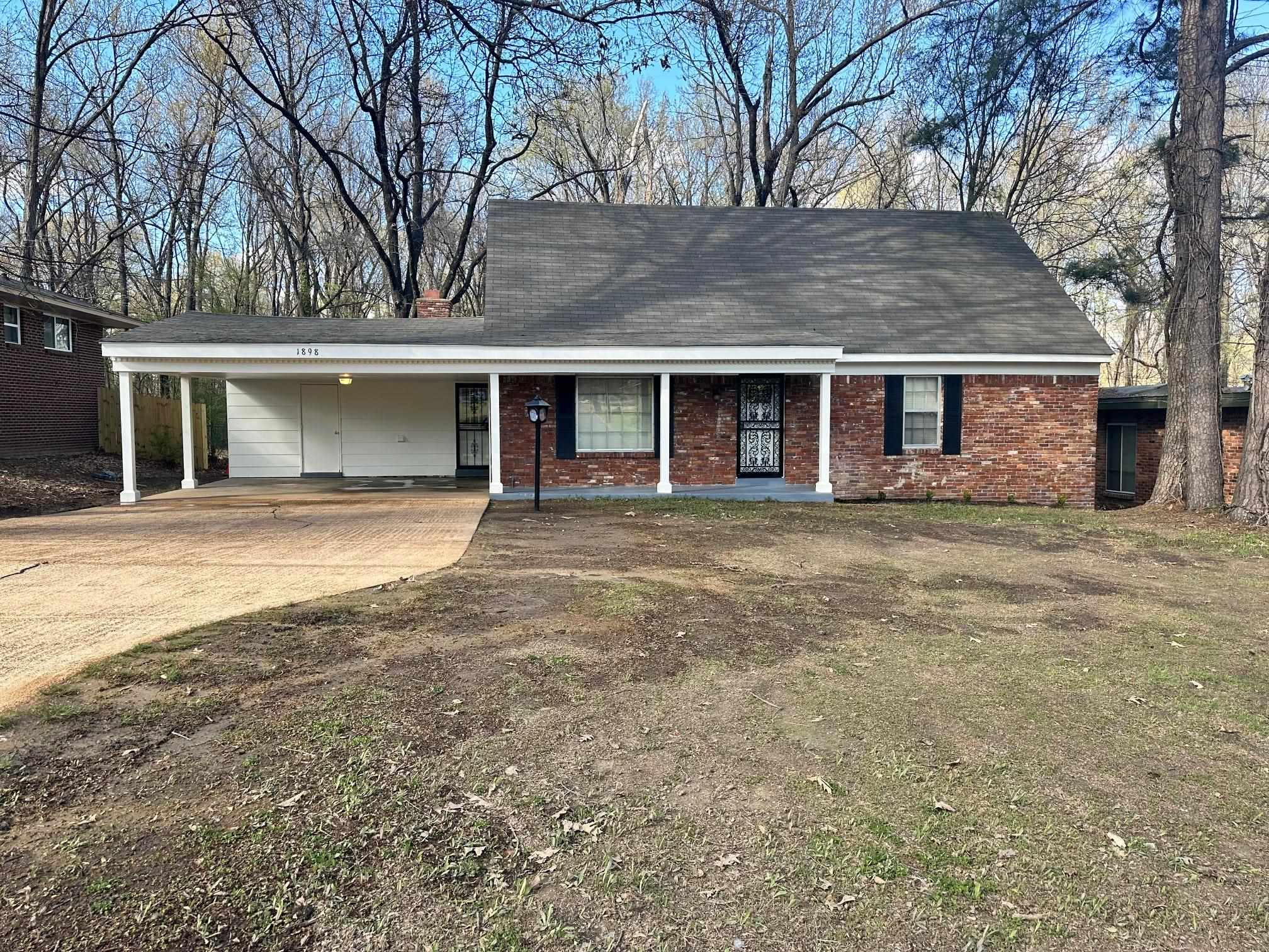 1898 Pennel Road Memphis, TN 38116 - Photo 1 of 34 front view of a house with a yard