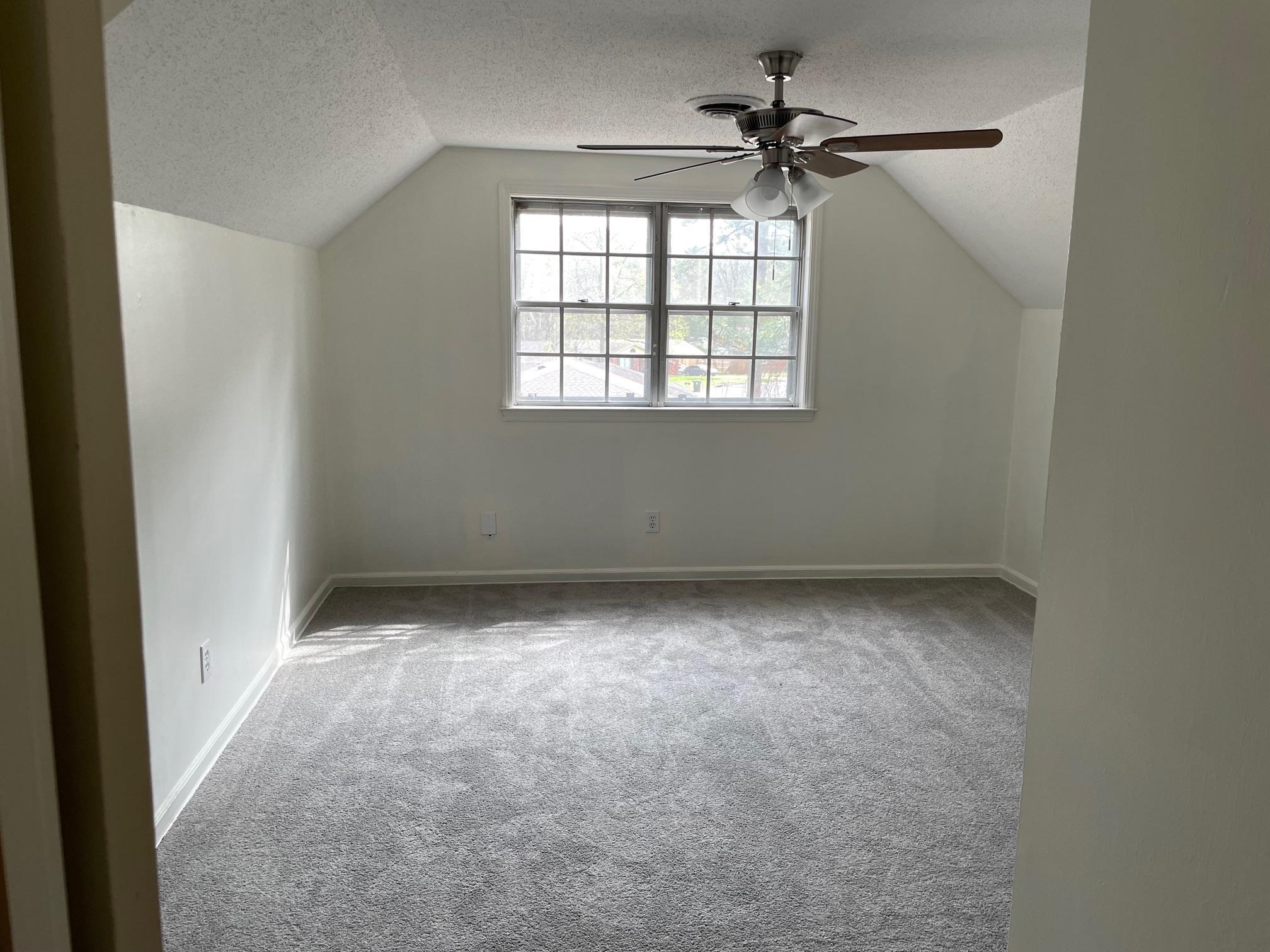 1898 Pennel Road Memphis, TN 38116 - Photo 20 of 34 an empty room with a window and a fan