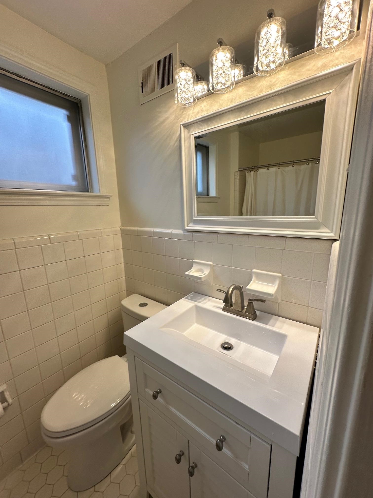 1898 Pennel Road Memphis, TN 38116 - Photo 24 of 34 a bathroom with a sink and a mirror
