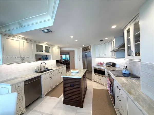 a room with a wooden floor and a sink