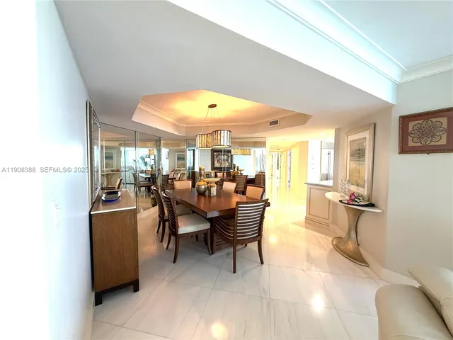 a spacious bedroom with a bed and glass window