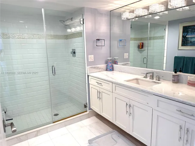 a bedroom with a bed and large flat screen tv