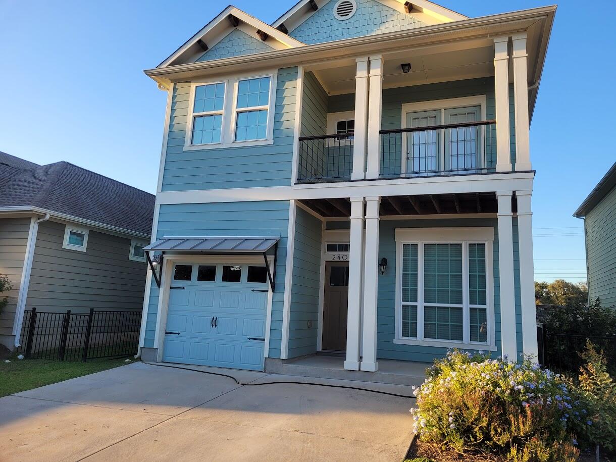 2404 Vintage Stave Road, Unit 102 Austin, TX 78748 - Photo 1 of 39 a front view of a house with a garden
