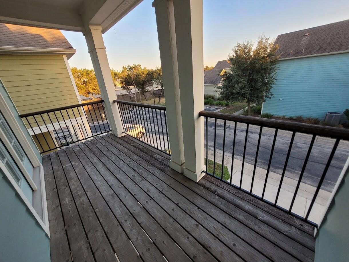 2404 Vintage Stave Road, Unit 102 Austin, TX 78748 - Photo 24 of 39 a view of balcony with wooden floor