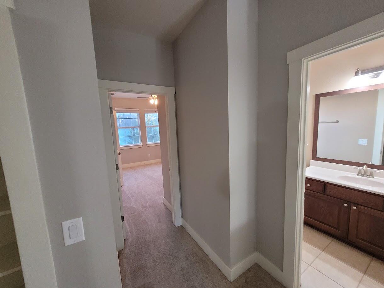 2404 Vintage Stave Road, Unit 102 Austin, TX 78748 - Photo 25 of 39 a en suite bathroom with a sink and a mirror