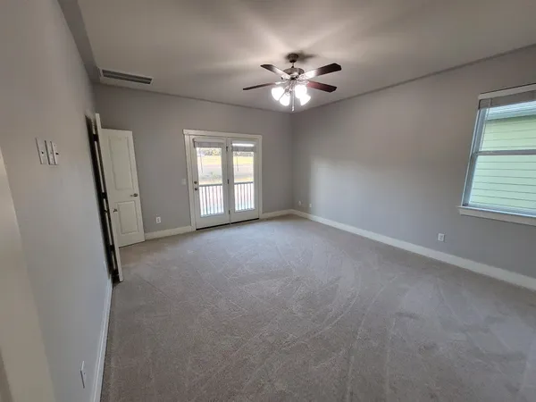 a view of a glass door and wooden floor