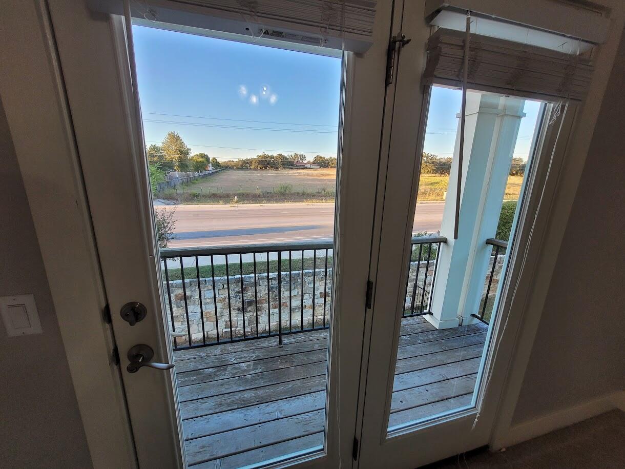 2404 Vintage Stave Road, Unit 102 Austin, TX 78748 - Photo 34 of 39 a view of a glass door and wooden floor