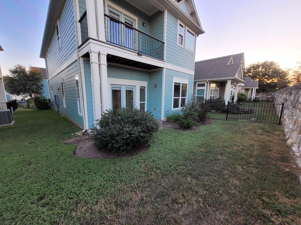 2404 Vintage Stave Road, Unit 102 Austin, TX 78748 - Photo 39 of 39 a front view of a house with garden