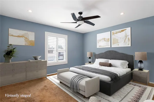 a bedroom with a large bed and a window