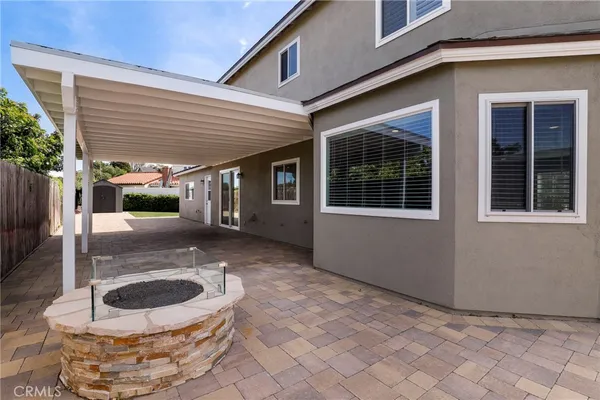 a view of a porch with a hanging chair