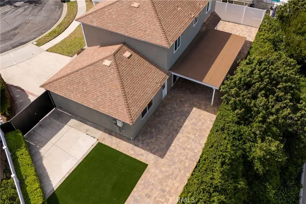 a view of a backyard with sitting area