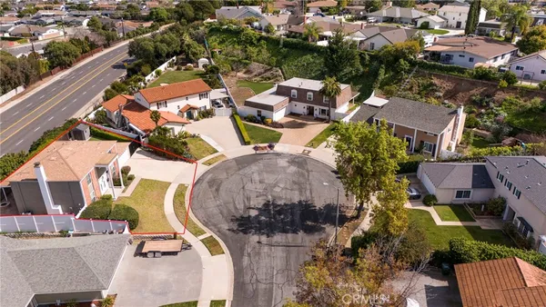 an aerial view of residential houses with outdoor space
