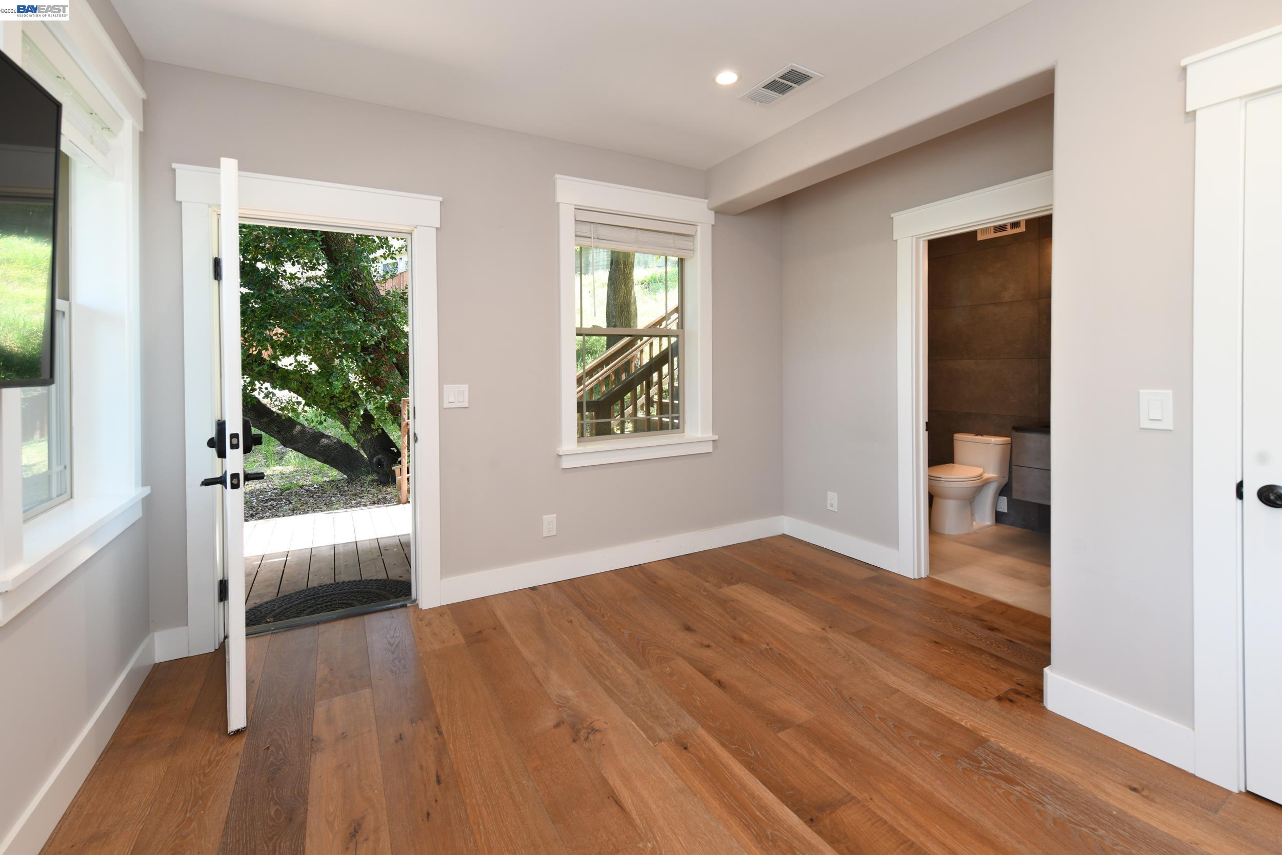 1516 Pleasant Hill Road Lafayette, CA 94549 - Photo 23 of 38 wooden floor in an empty room with a window