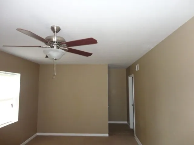 a view of a room with a fan