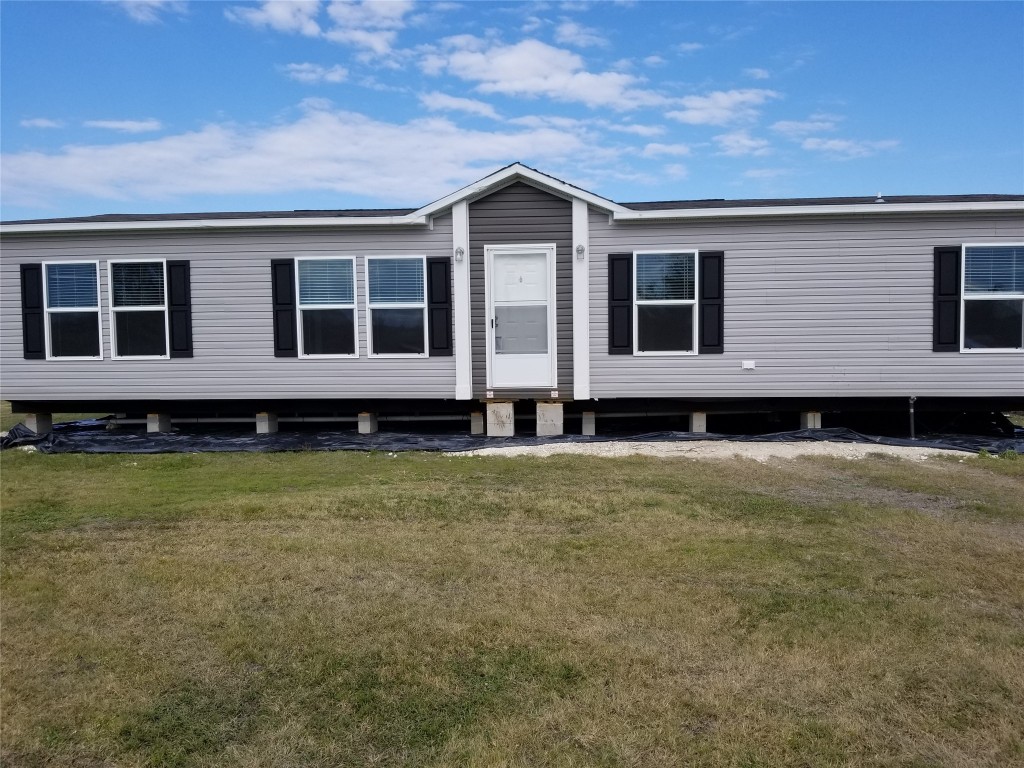 a view of a house with a garden