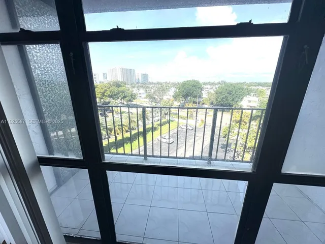 a kitchen with a white cabinets and white appliances