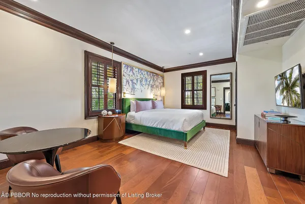 a bedroom with a large bed and a large window