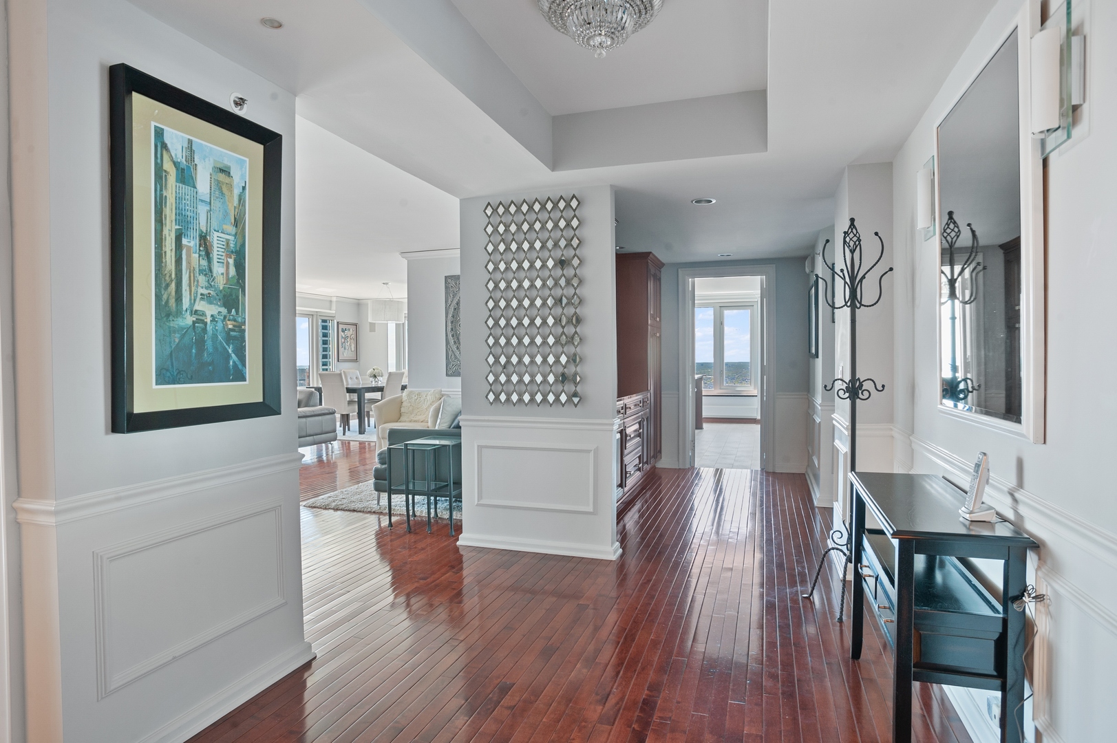 132 East Delaware Place, Unit 4801 Chicago, IL 60611 - Photo 13 of 20 a living room with furniture and wooden floor