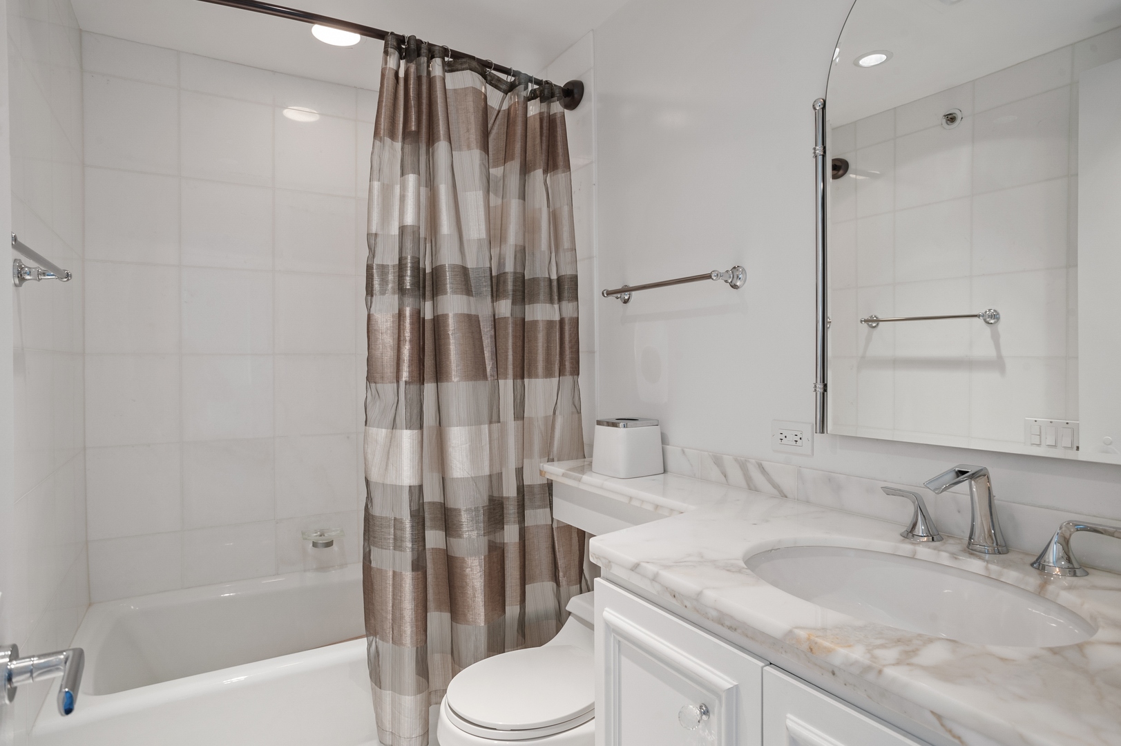 132 East Delaware Place, Unit 4801 Chicago, IL 60611 - Photo 15 of 20 a bathroom with a granite countertop sink toilet and shower