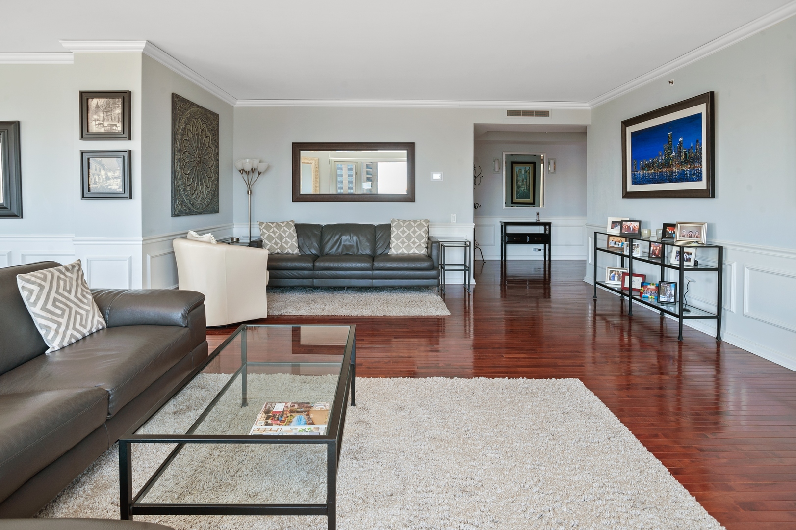 132 East Delaware Place, Unit 4801 Chicago, IL 60611 - Photo 3 of 20 a living room with furniture wooden floor and a table