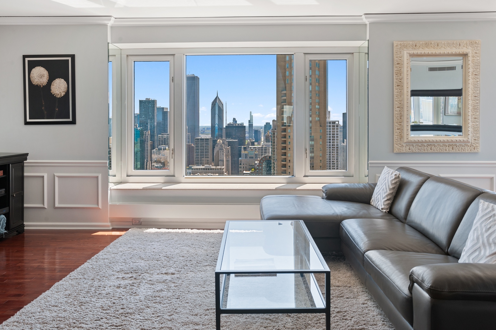 132 East Delaware Place, Unit 4801 Chicago, IL 60611 - Photo 4 of 20 a living room with furniture and a large window