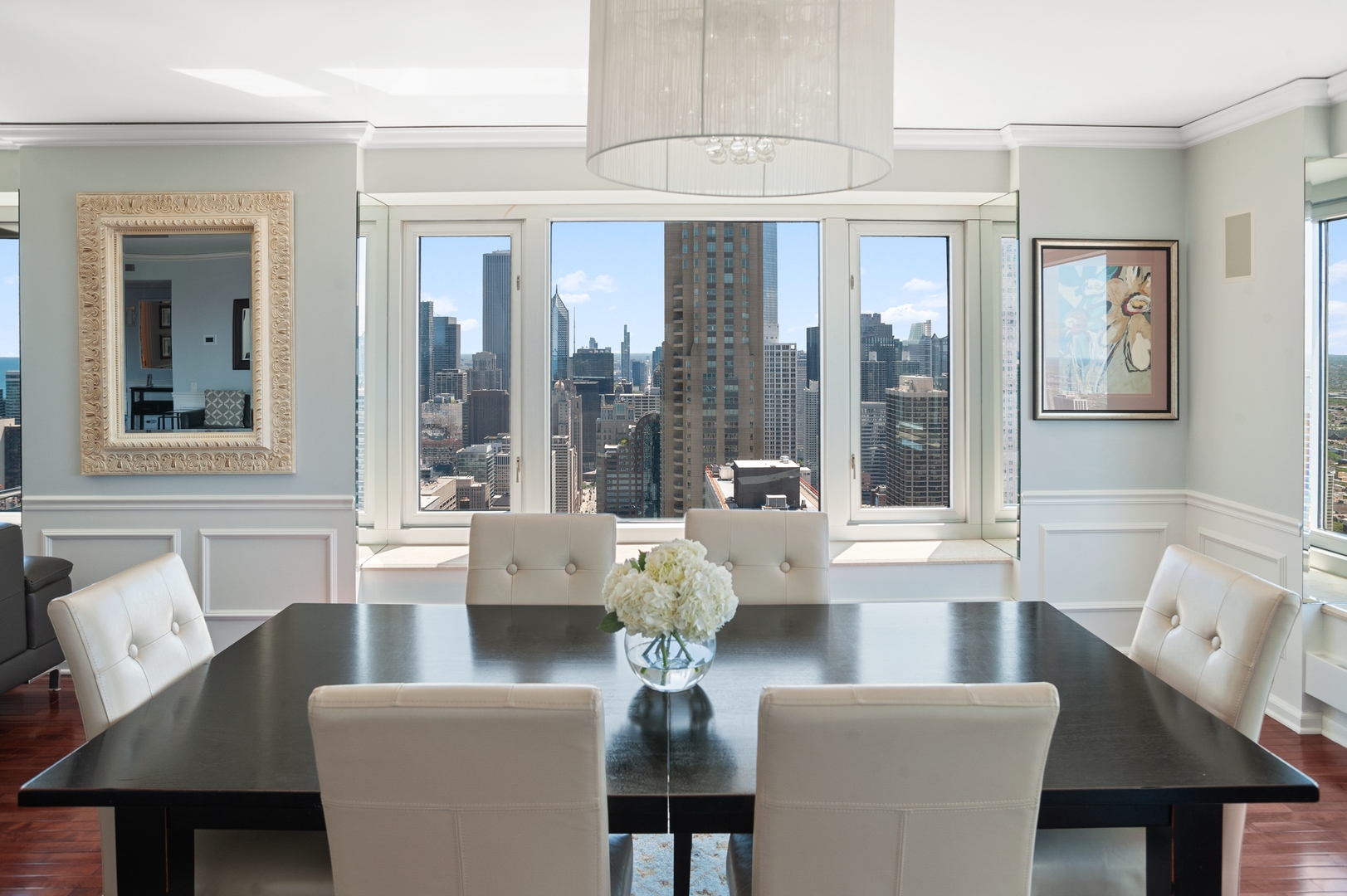 132 East Delaware Place, Unit 4801 Chicago, IL 60611 - Photo 7 of 20 a living room with fireplace furniture and a large window