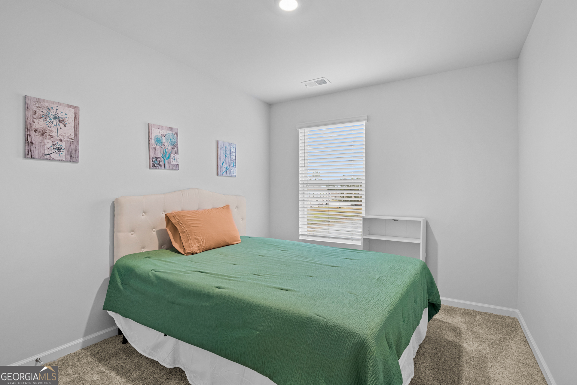 184 Coneflower Road Bloomingdale, GA 31302 - Photo 14 of 22 a bedroom with a bed and a window