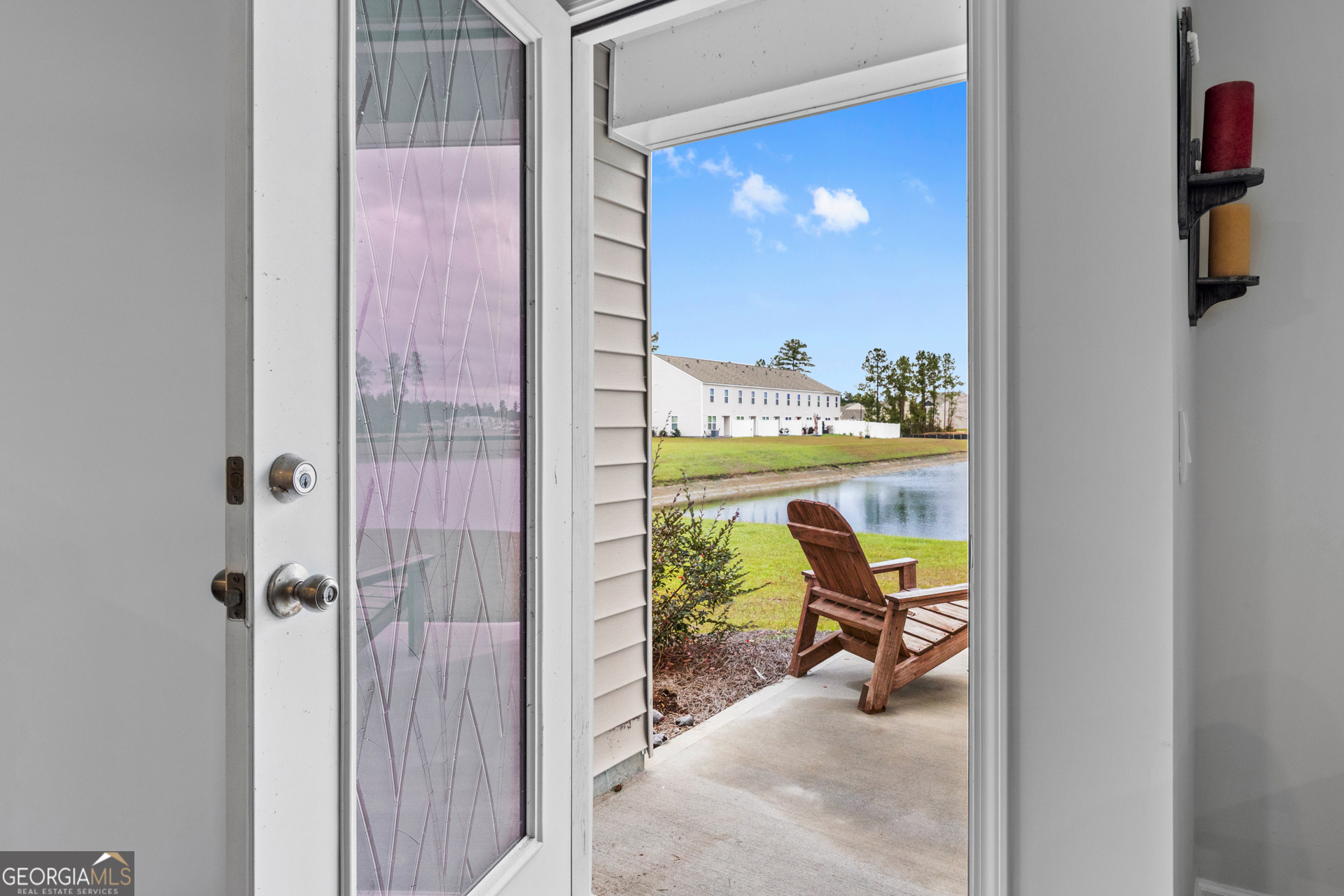 184 Coneflower Road Bloomingdale, GA 31302 - Photo 16 of 22 a view of a hallway with dining area and glass door