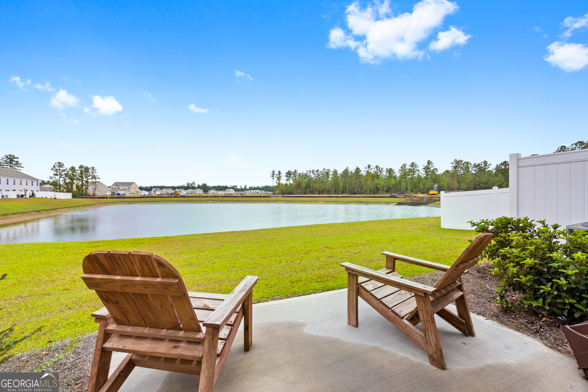 184 Coneflower Road Bloomingdale, GA 31302 - Photo 17 of 22 a view of a ocean with a table and chairs