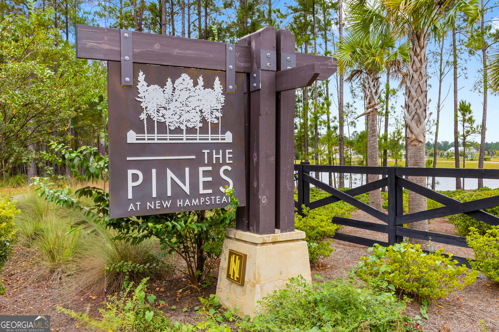 184 Coneflower Road Bloomingdale, GA 31302 - Photo 21 of 22 a view of a sign board with a small yard