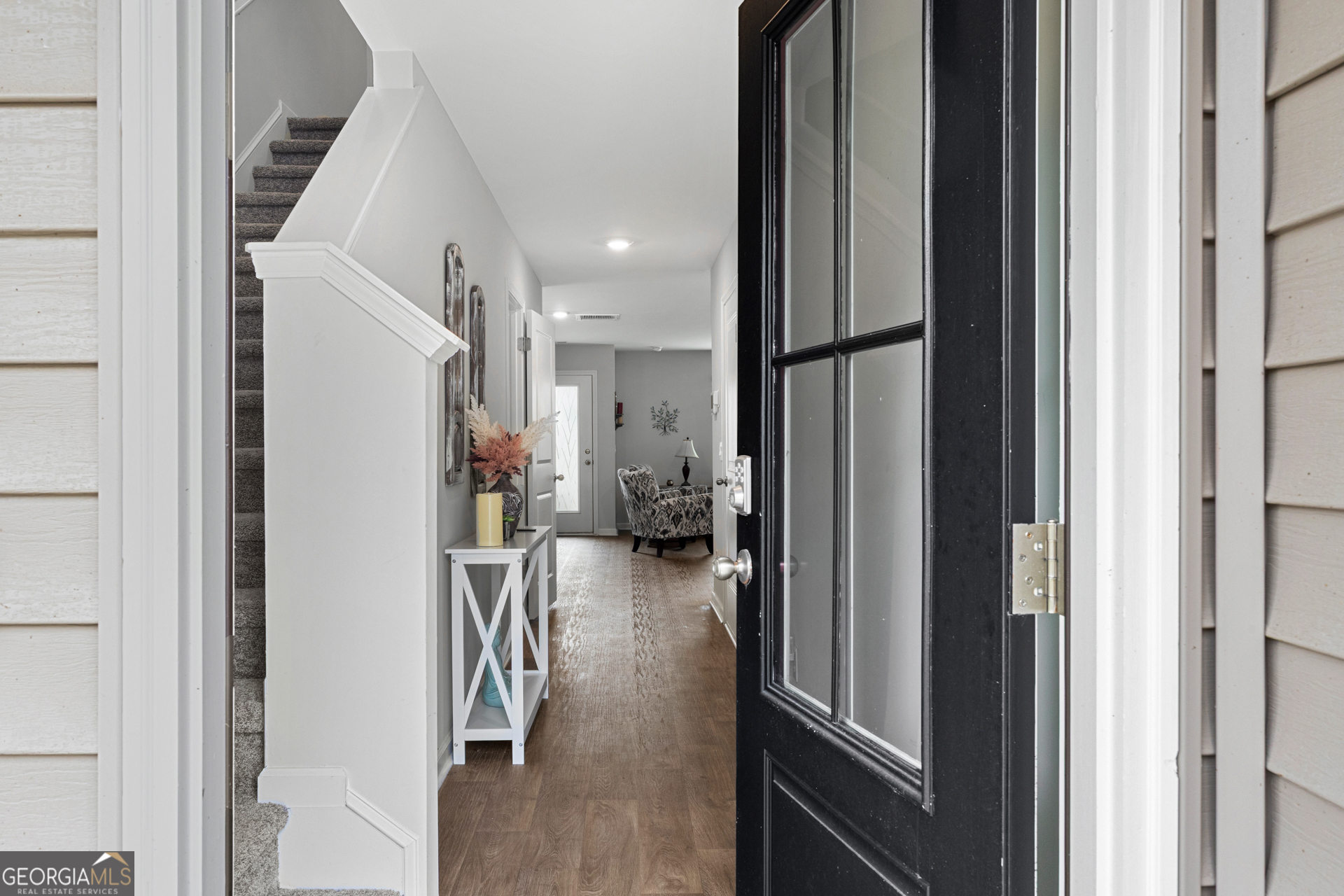 184 Coneflower Road Bloomingdale, GA 31302 - Photo 3 of 22 a view of hallway with living room and furniture