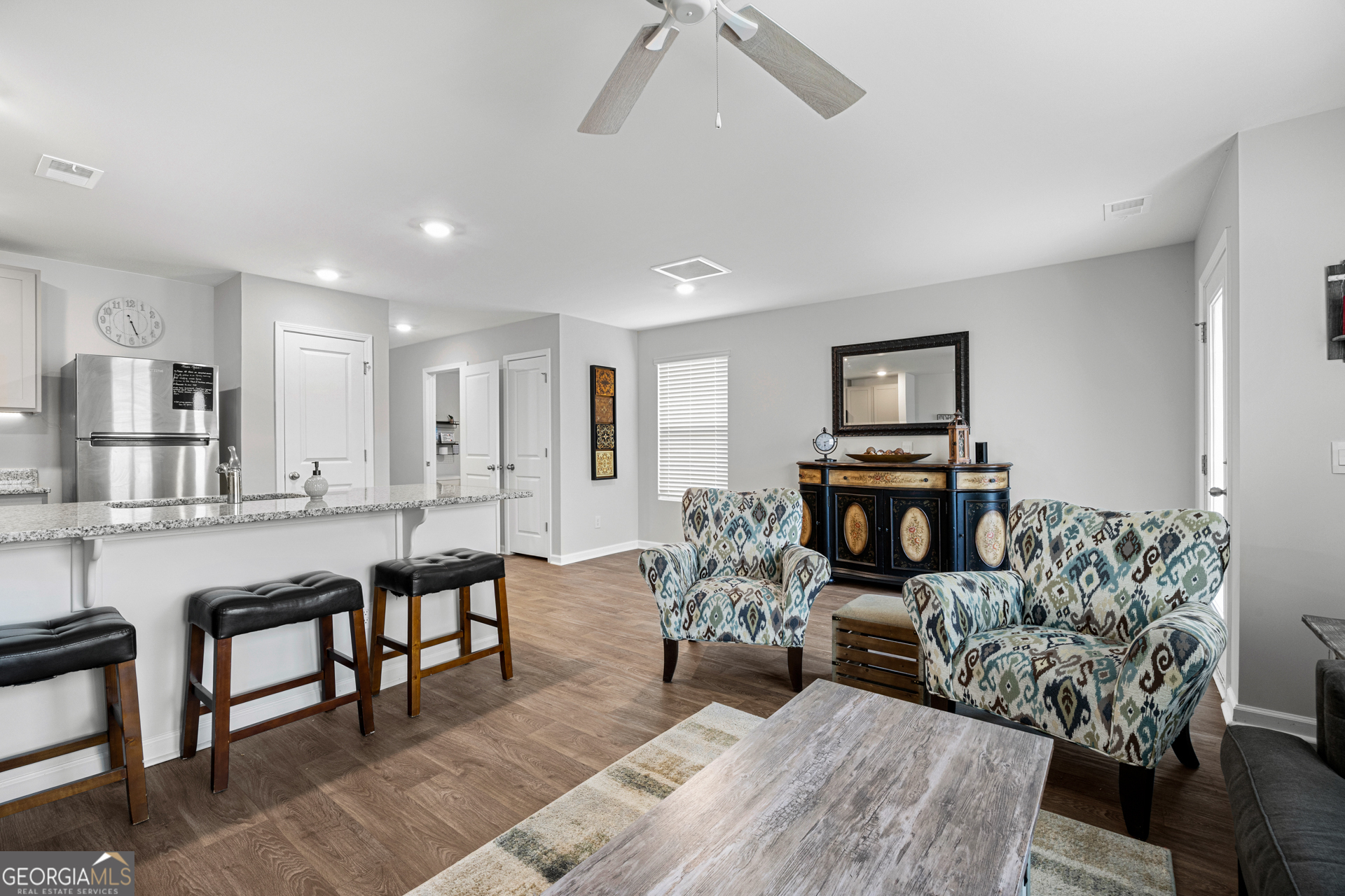 184 Coneflower Road Bloomingdale, GA 31302 - Photo 5 of 22 a living room with furniture a fireplace and a table