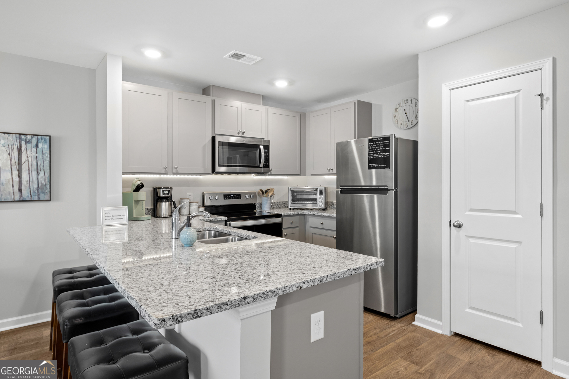 184 Coneflower Road Bloomingdale, GA 31302 - Photo 6 of 22 a kitchen with stainless steel appliances granite countertop a sink refrigerator and microwave