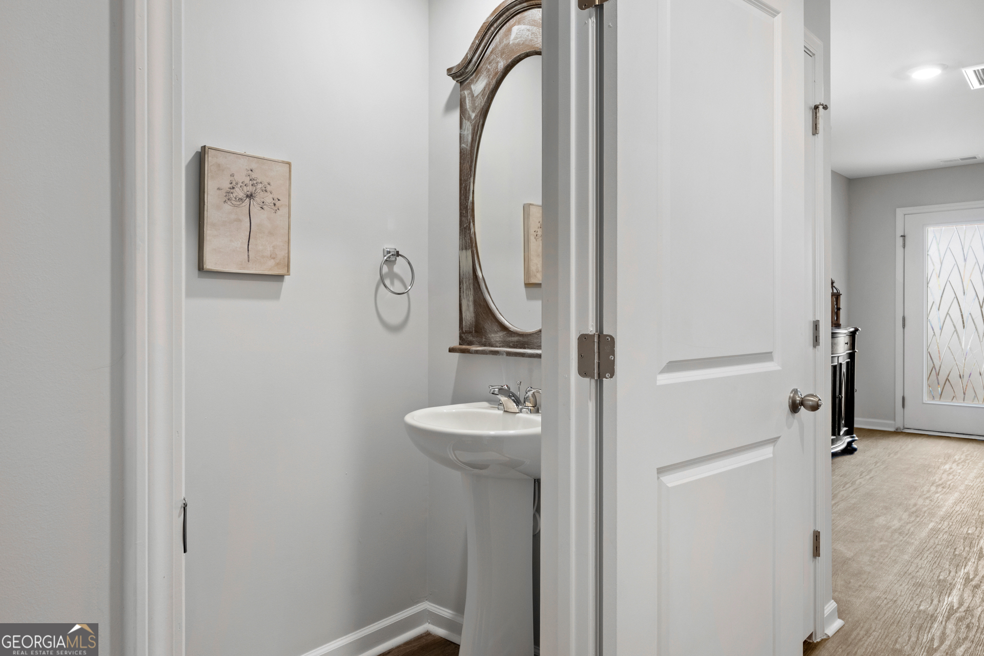 184 Coneflower Road Bloomingdale, GA 31302 - Photo 7 of 22 a bathroom with a sink and a mirror
